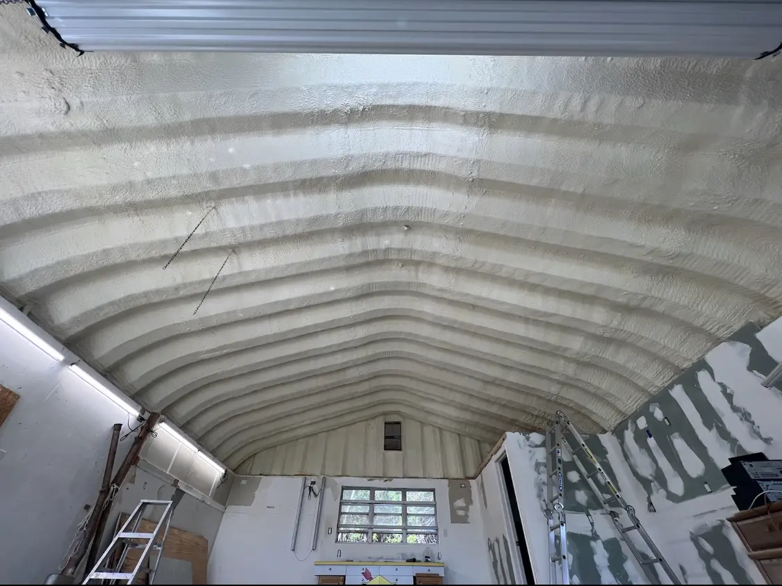 Spray polyurethane foam applied to the underside of a metal roof deck in Duryea